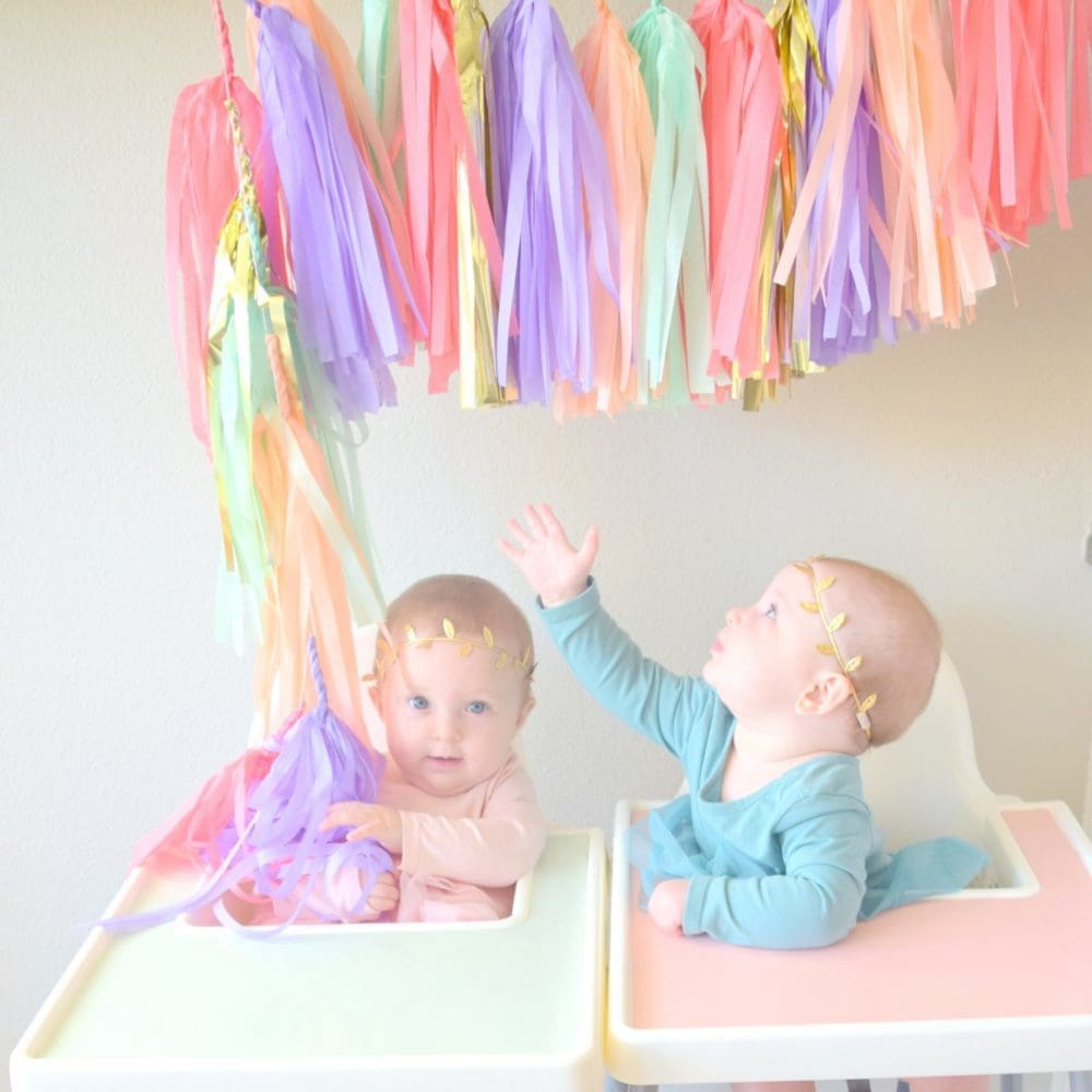 Monthly baby pictures 6 month pictures tassle garland Ikea ANTILOP highchair cover and placemats