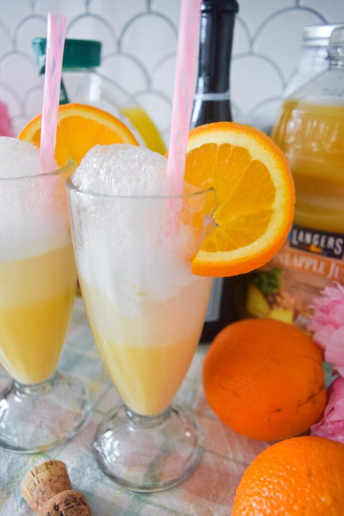 Pineapple Orange Sherbet Mimosa recipe with orange juice, prosecco, pineapple juice, and pineapple sherbet