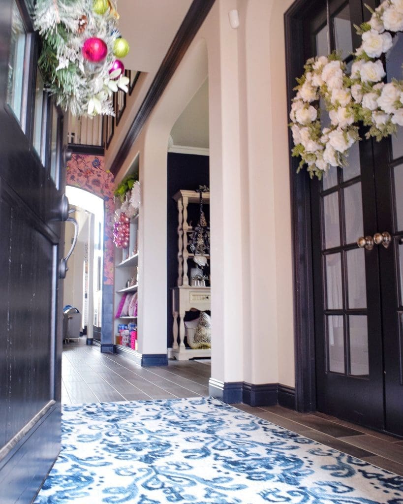 entryway holiday decor with blue and white rug