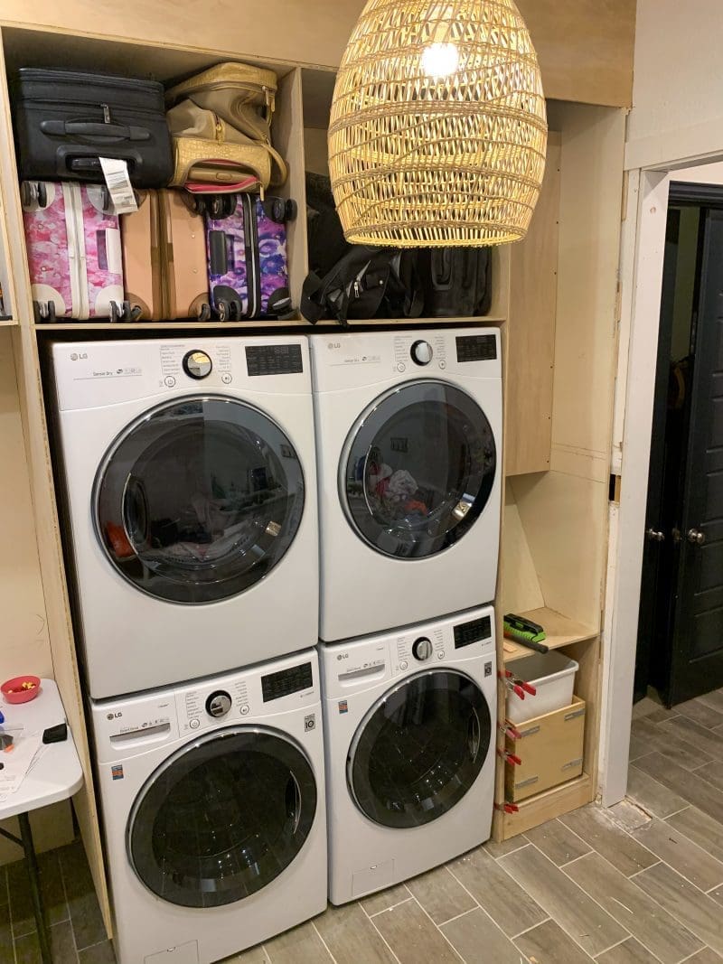 cabinets around double washer and dryer