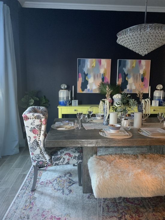 dining room with navy wall and green buffet table