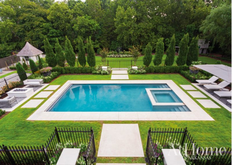 rectangle pool design with in level spa and turf surround